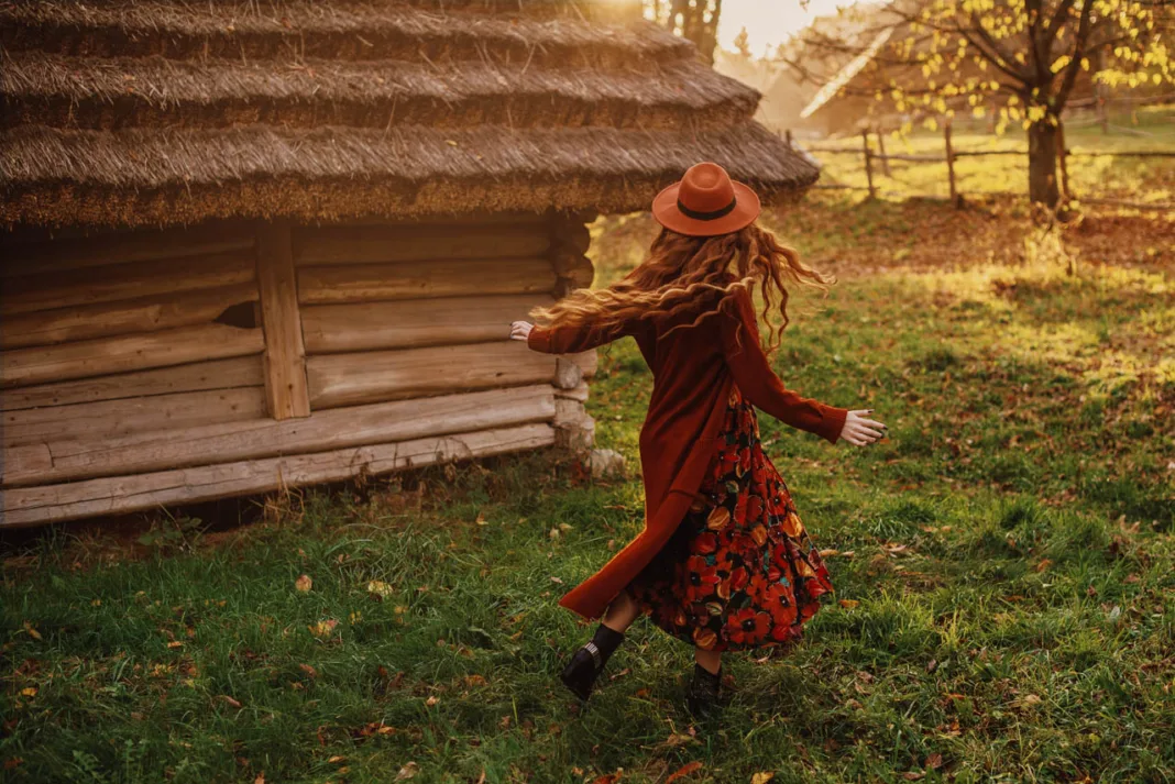 Rear,,back,view,of,young,redhead,woman,with,long,natural